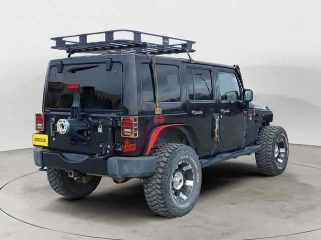 Used 2012 Black Jeep Unlimited Sahara Altitude image 5