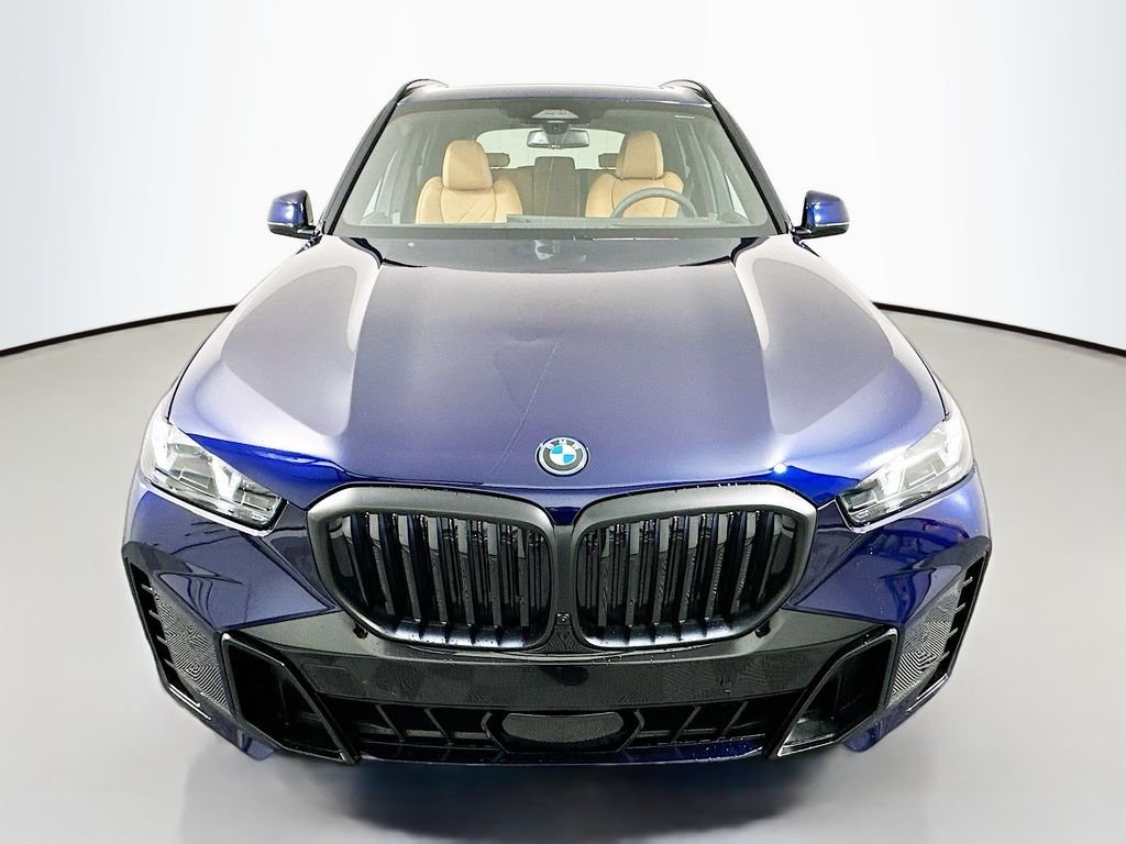 Used 2026 Tanzanite Blue II Metallic BMW xDrive50e image 2