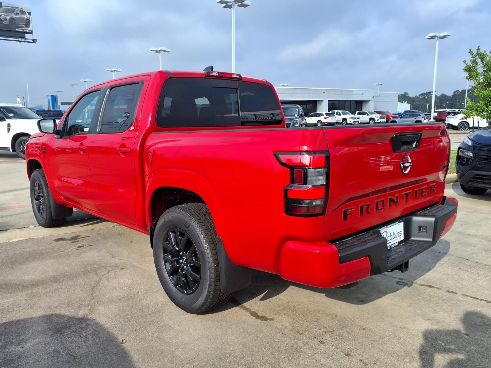 2026 Nissan Frontier SV Red at Robbins Nissan
