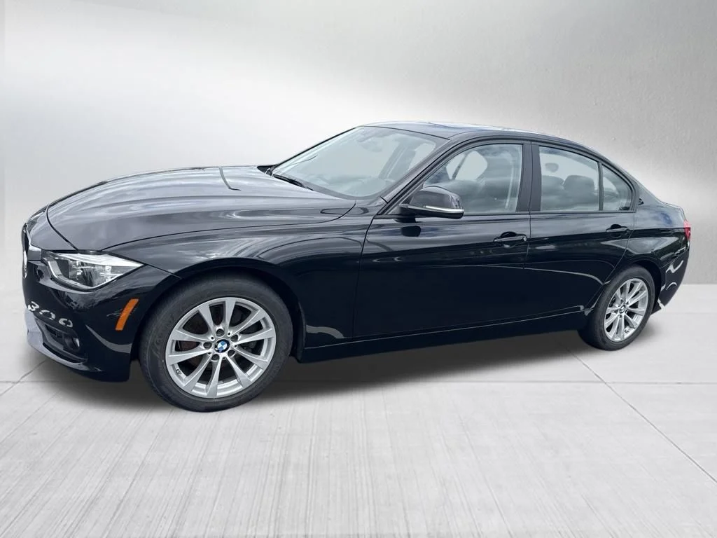 Used 2018 Black BMW 320i xDrive image 1