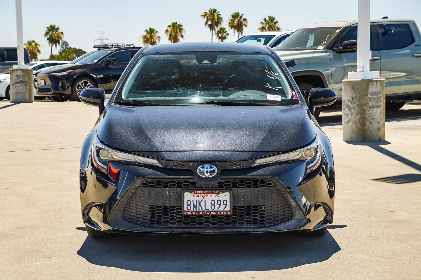 Used 2021 Black Sand Pearl Toyota Hybrid LE image 2