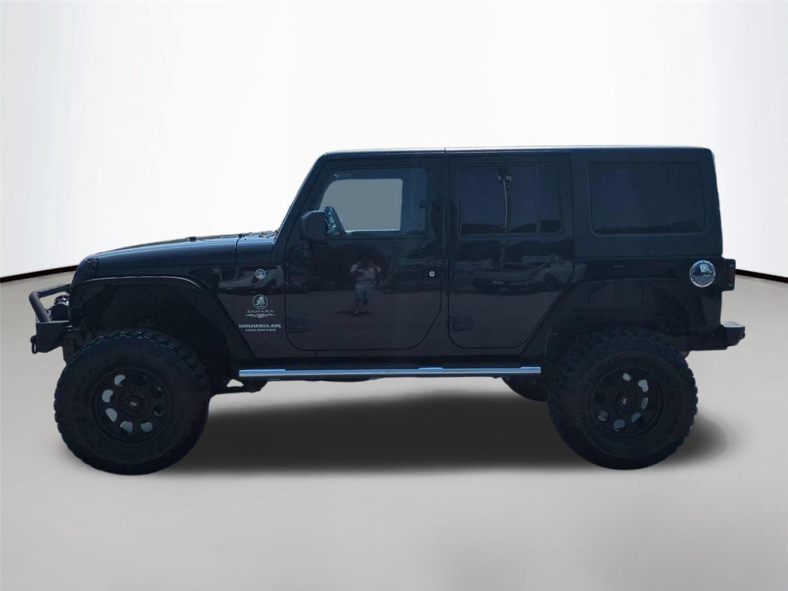 Used 2012 Black Clearcoat Jeep Sahara image 2