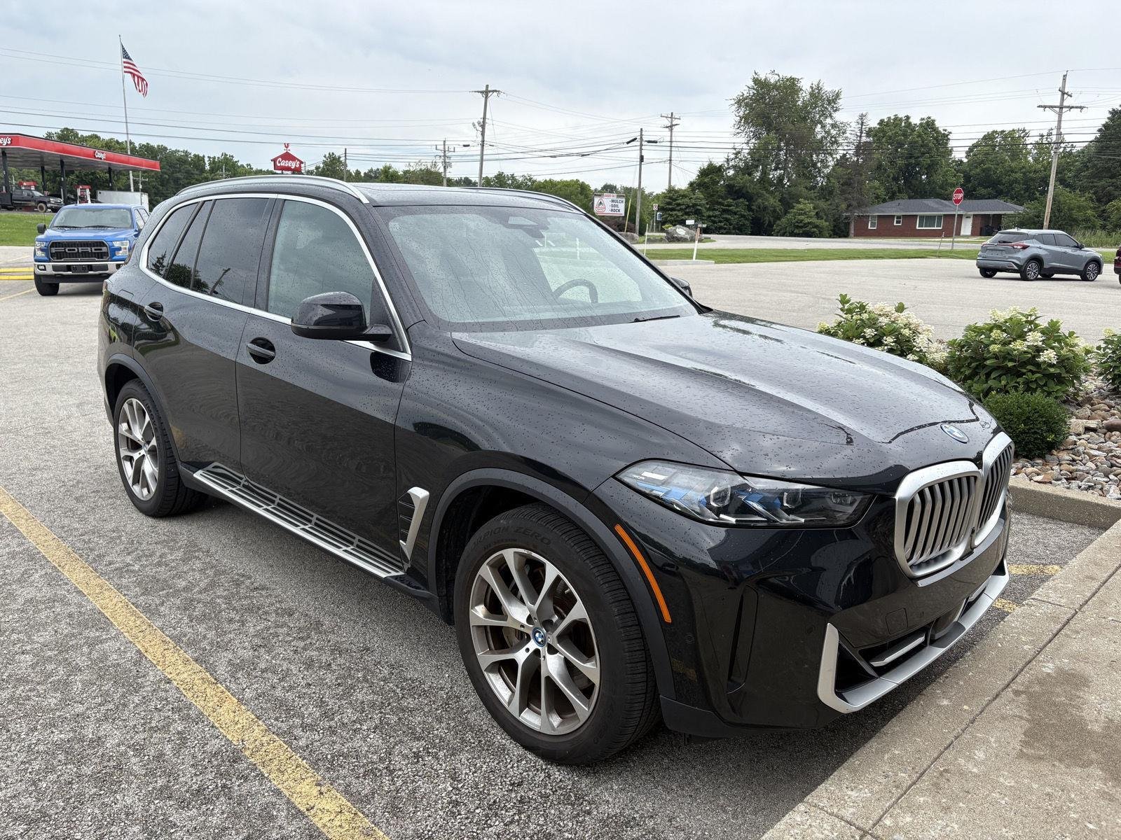 Used 2025 BLACK BMW XDRIVE50E PLUG-IN HYBRID image 2