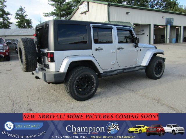 Used 2012 Silver Jeep Unlimited Sahara image 4