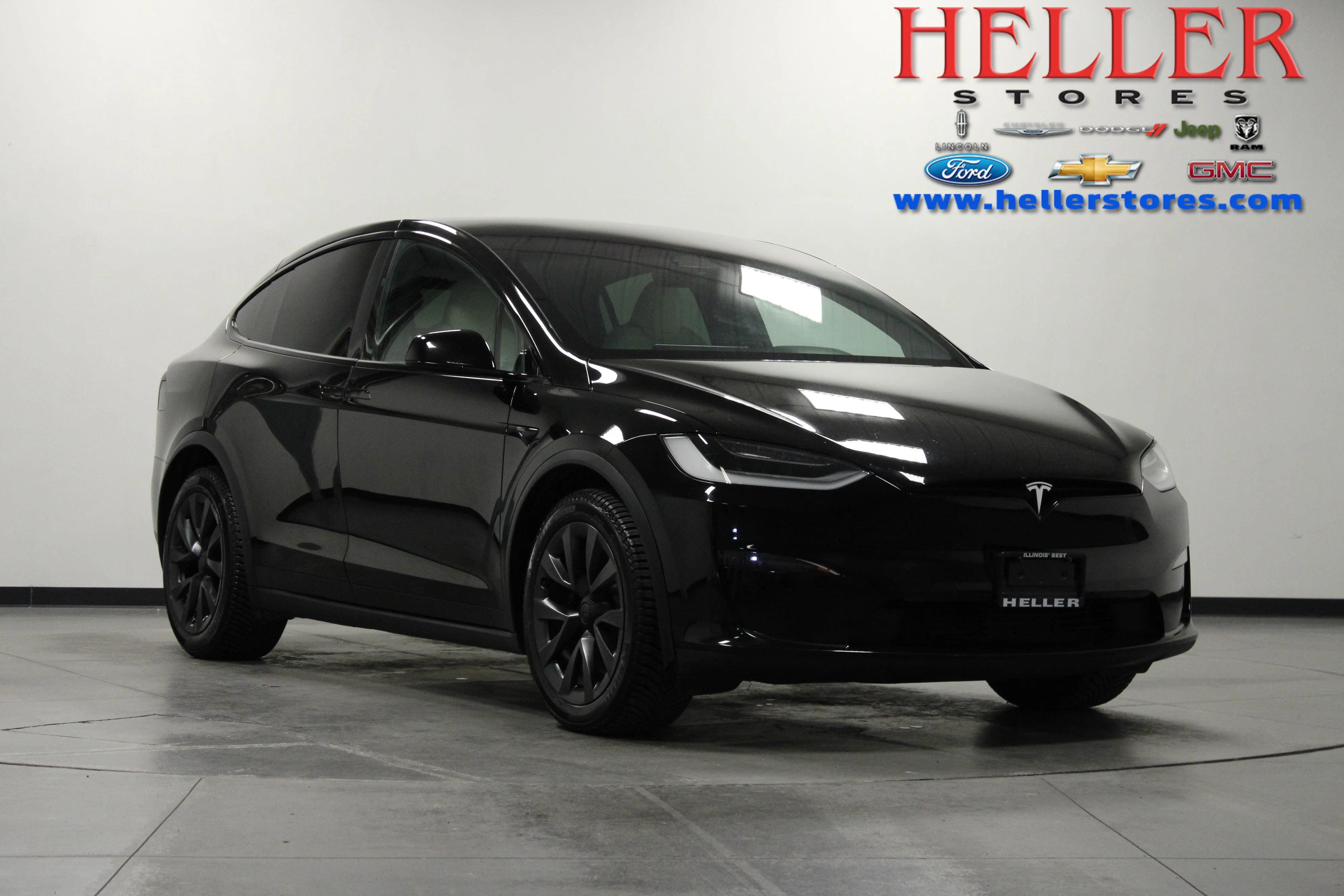 Used 2023 Solid Black Tesla Base image 1