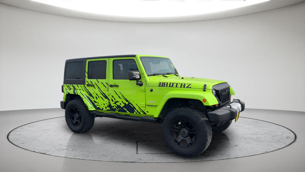 Used 2013 Green Jeep Unlimited Sahara image 1