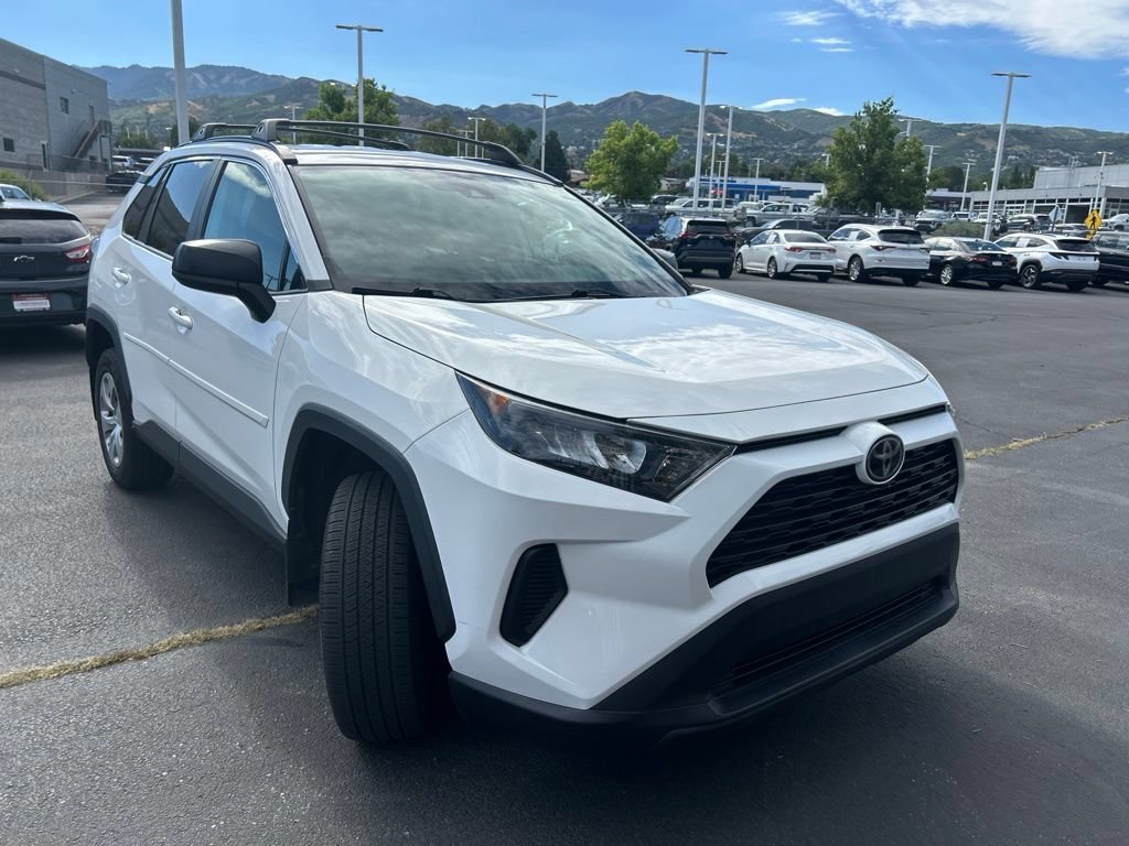 Used 2021 Super White Toyota LE image 2