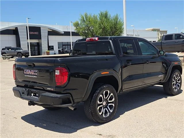 Used 2024 Onyx Black GMC AT4 4x4 Crew Cab 5 ft. box 131 in. WB image 3