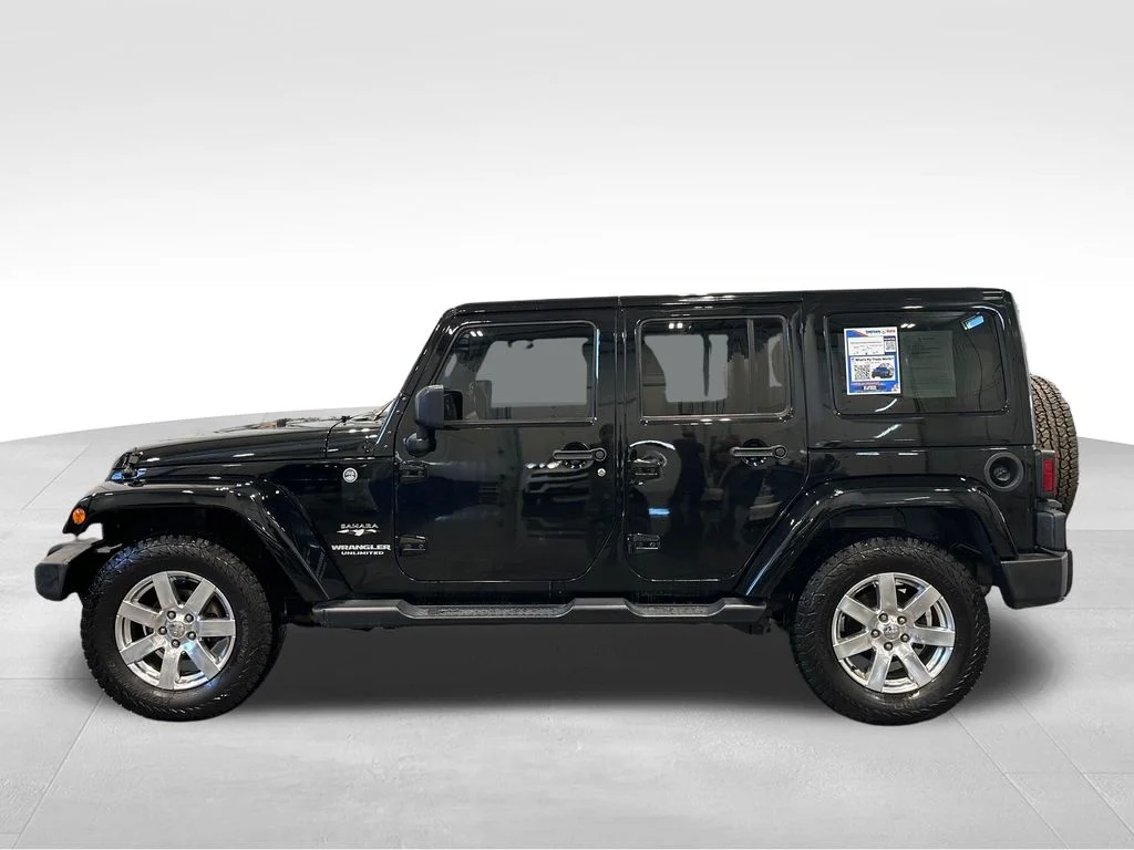 Used 2016 Black Jeep Unlimited Sahara image 4