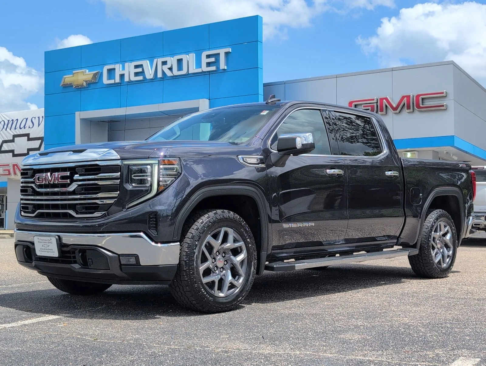 Used 2023 Titanium Rush Metallic GMC SLT image 1