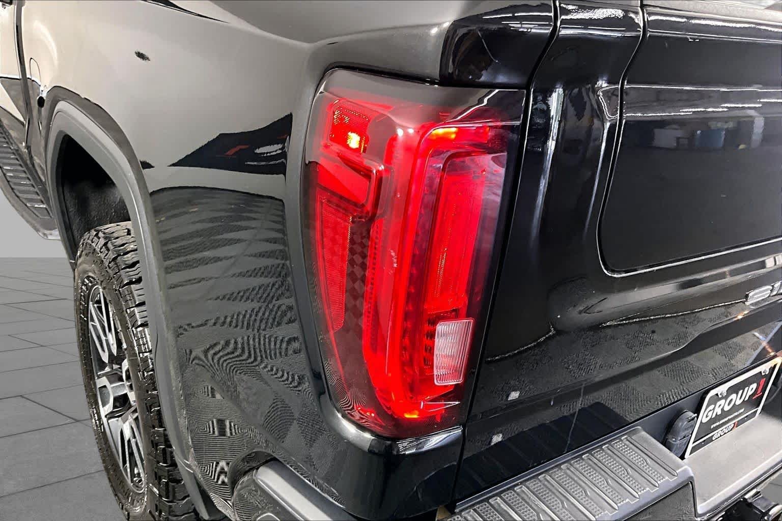Used 2021 EBONY TWILIGHT METALLIC GMC AT4 image 28