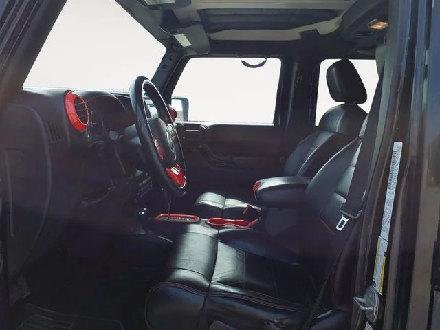 Used 2012 Black Jeep Unlimited Sahara Altitude image 15