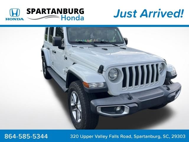 Used 2018 Bright White Clearcoat Jeep Unlimited Sahara image 1
