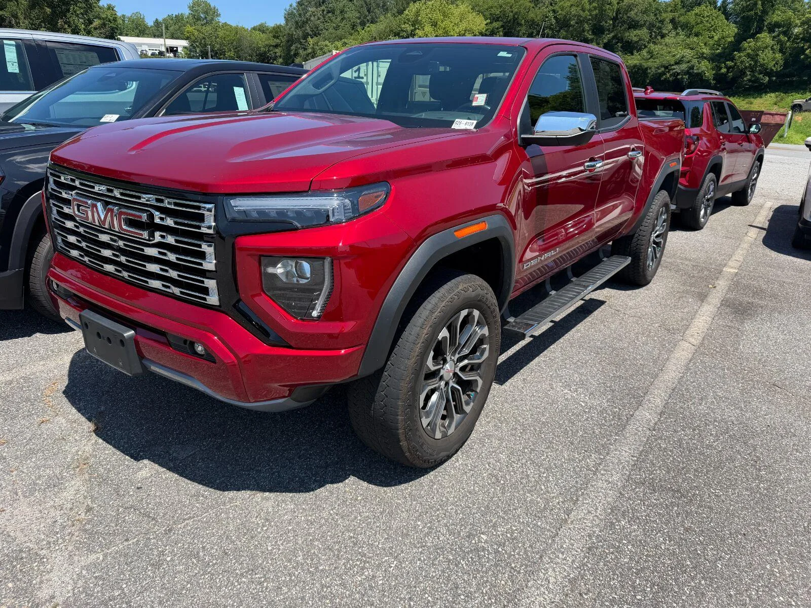 Used 2023 VOLCANIC RED TINTCOAT GMC 4WD Denali image 2