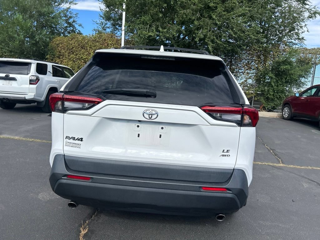 Used 2021 Super White Toyota LE image 6