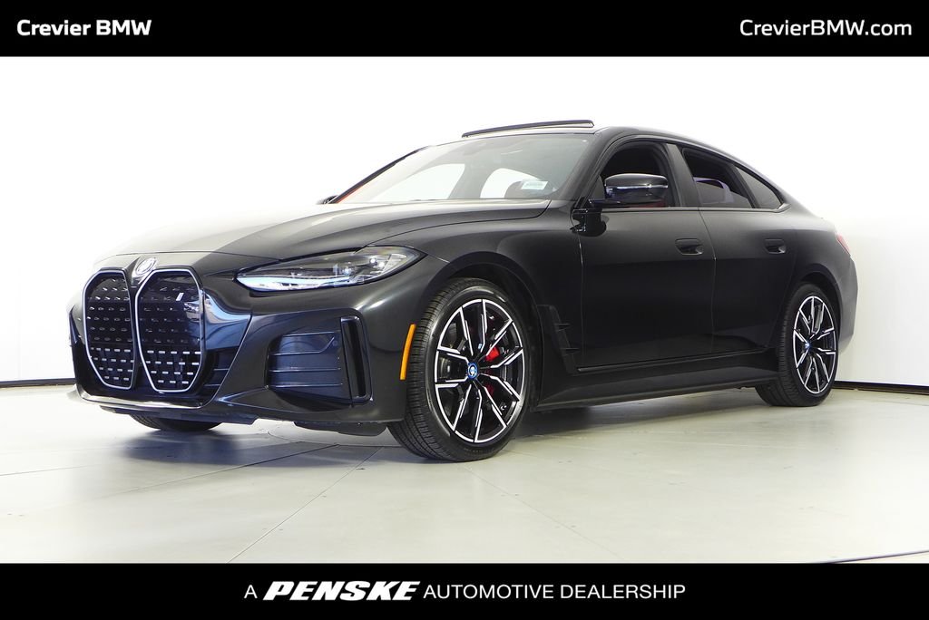 Used 2023 Black Sapphire Metallic BMW eDrive40 image 1