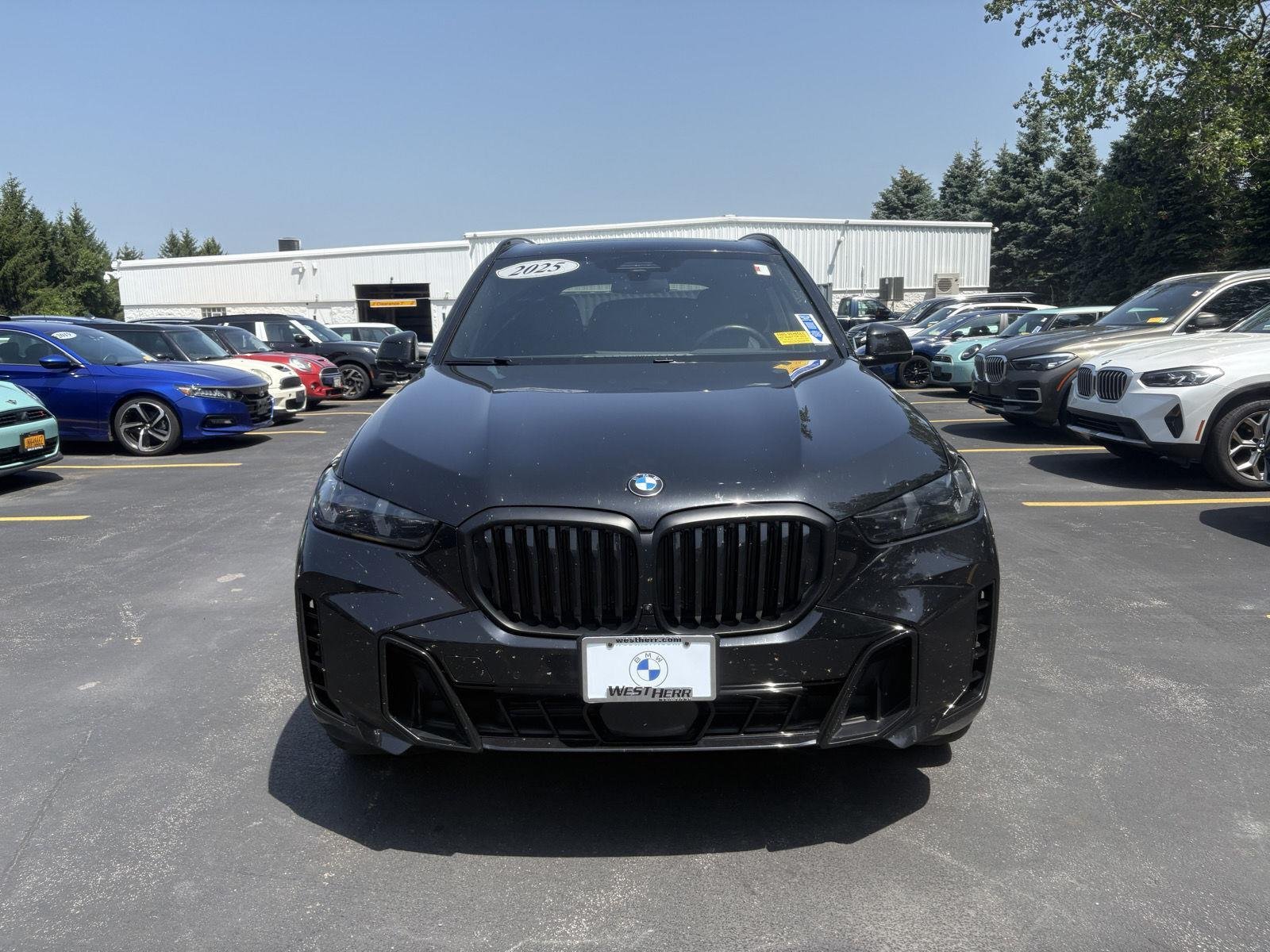 Certified Used 2025 Black Sapphire Metallic BMW xDrive40i image 3