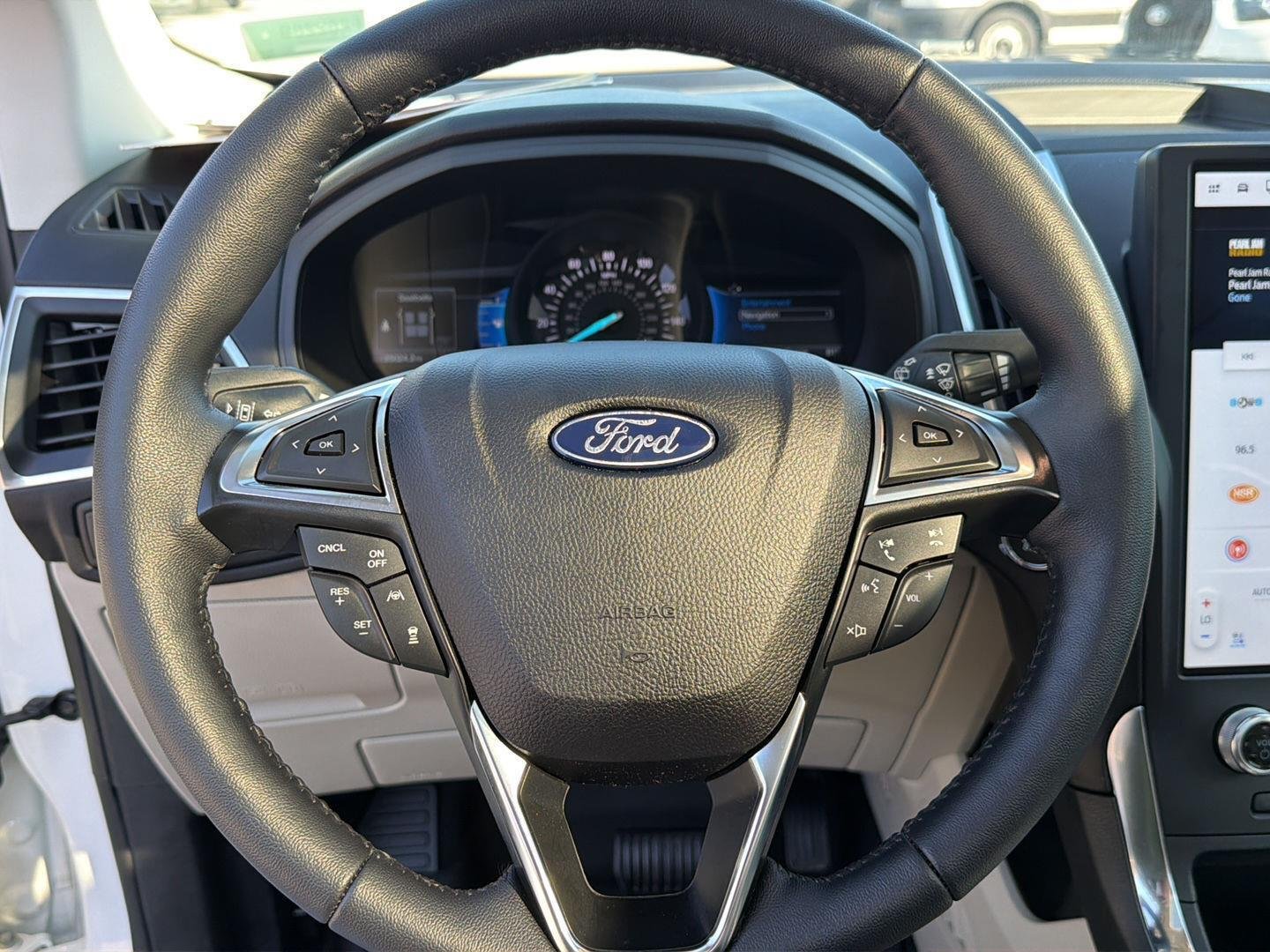 Used 2024 Star White Metallic Tri-Coat Ford Titanium image 21