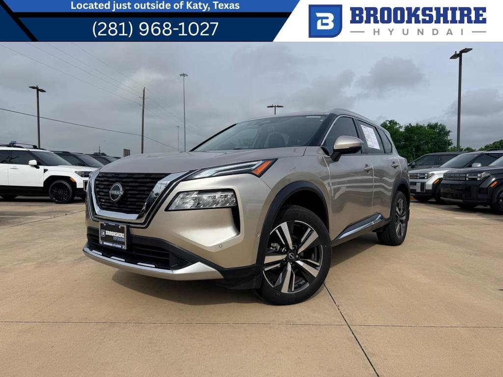 Used 2023 Champagne Silver Metallic Nissan Platinum image 1
