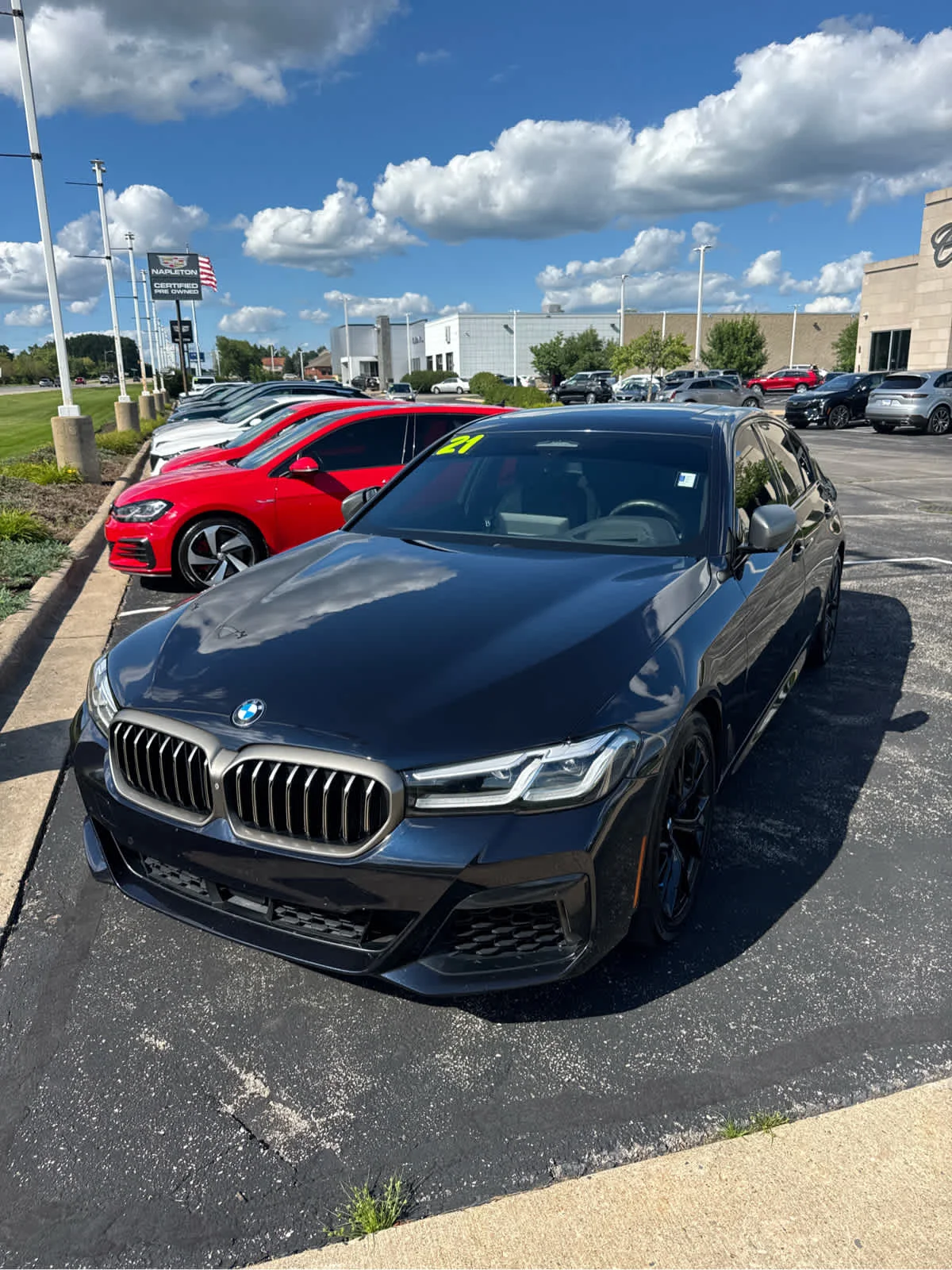 Used 2021 Black BMW M550i xDrive image 1