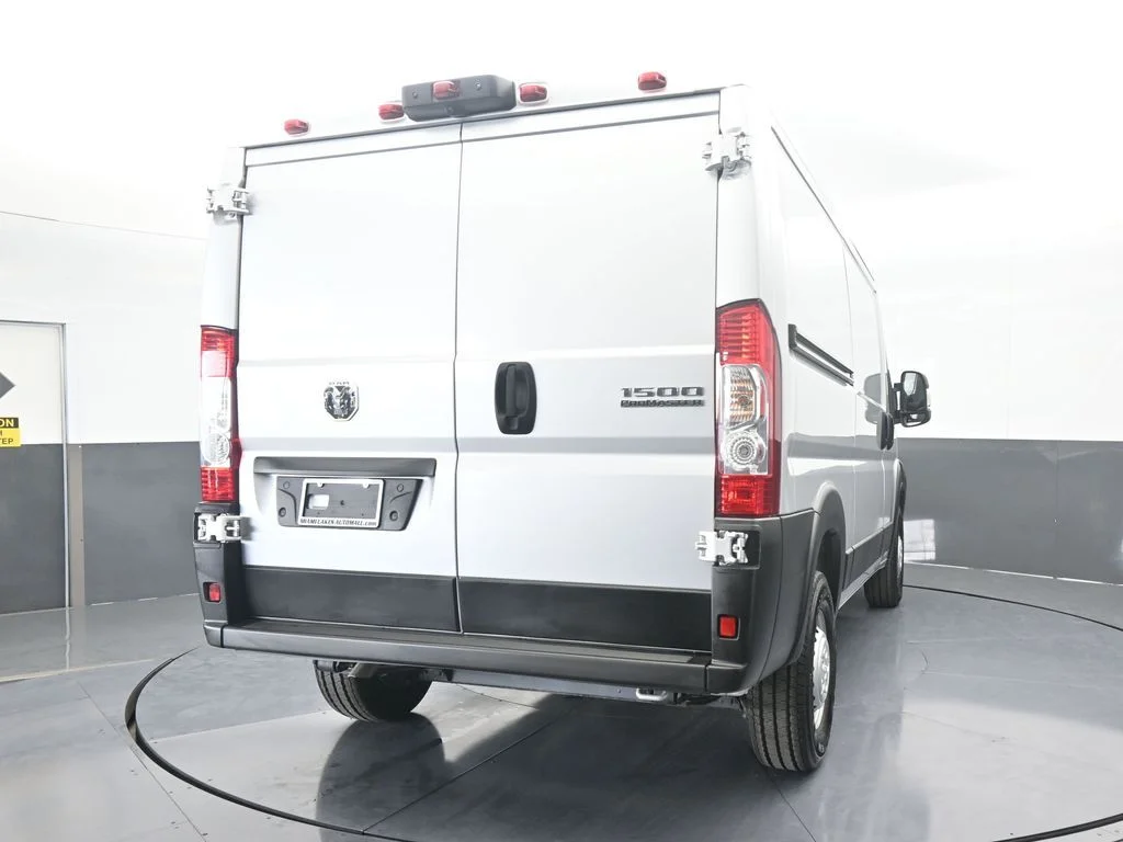 Used 2025 Bright Silver Clearcoat Metallic Ram Low Roof image 5