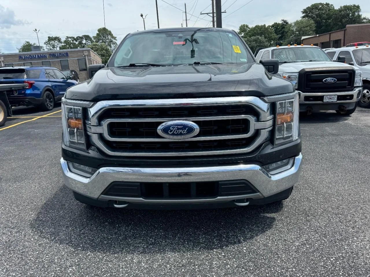 Used 2021 Agate Black Metallic Ford XLT 4WD SuperCrew 5.5' Box image 3