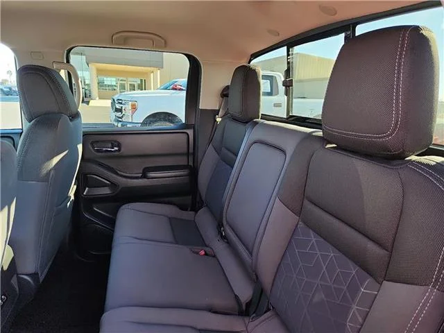 Used 2025 Red Alert Nissan SV 4x4 Crew Cab 5 ft. box 126 in. WB image 8