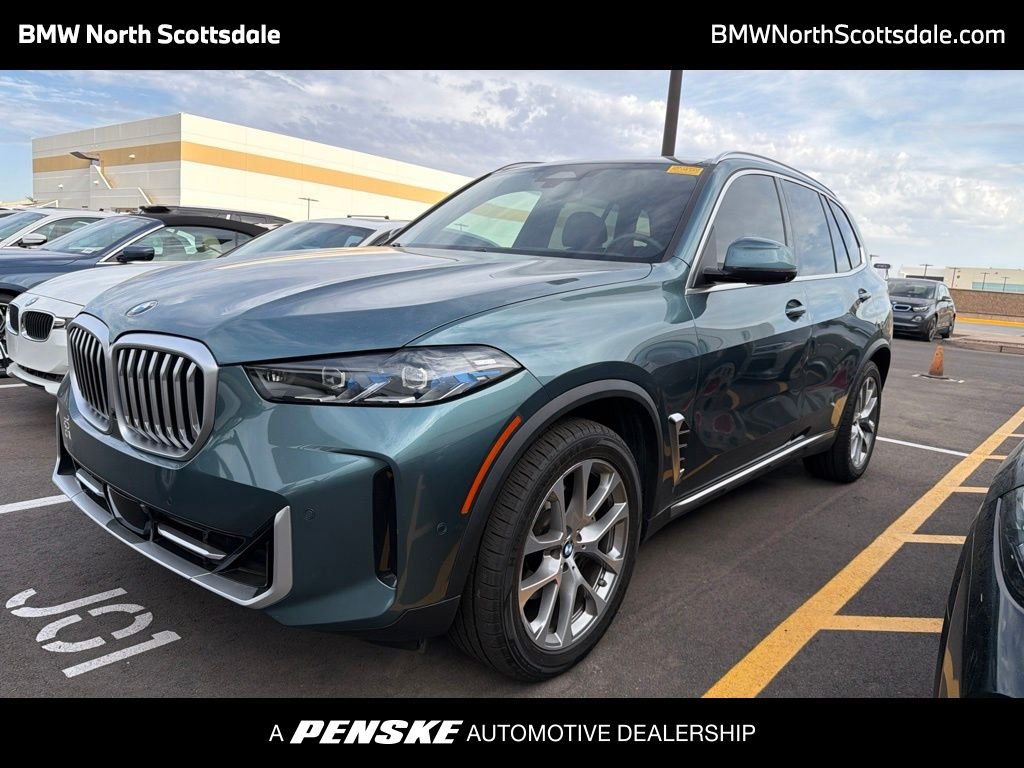 Certified Used 2024 Blue BMW xDrive40i image 1