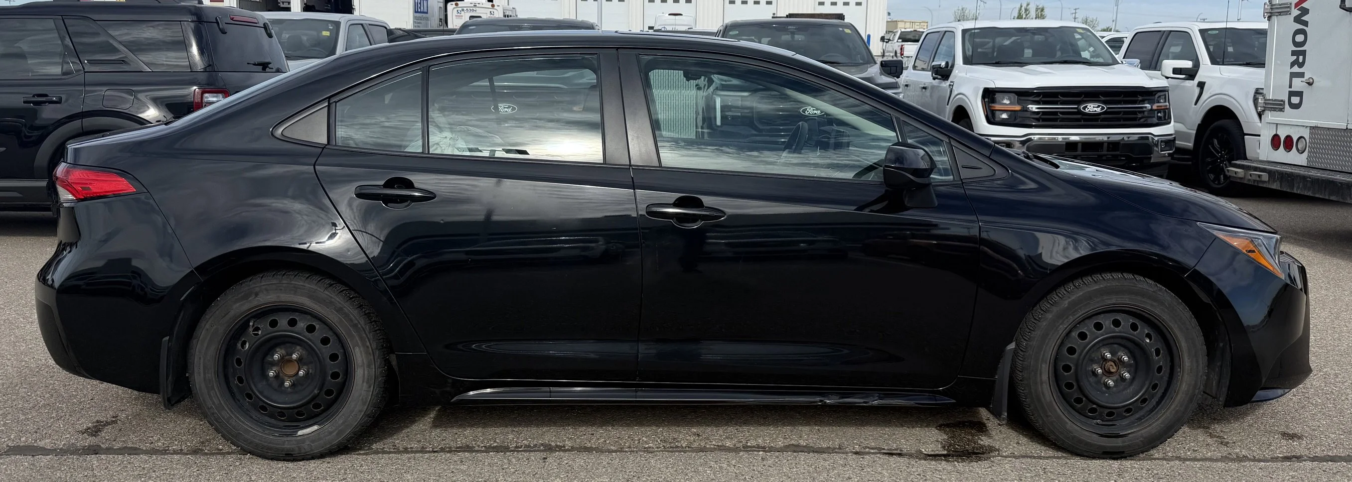 Used 2023 BLACK Toyota LE image 2
