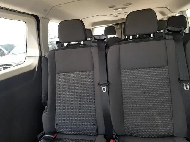 New 2026 Oxford White Ford Passenger Van XLT image 25