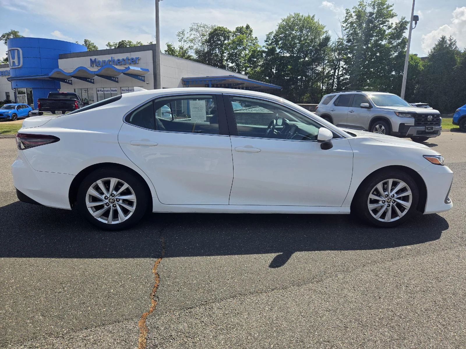 Used 2022 Super White Toyota LE image 6