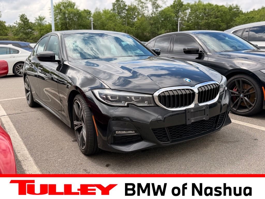 Used 2022 Black Sapphire Metallic BMW 330i xDrive image 1