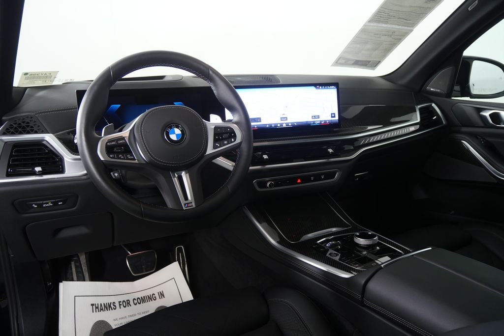 Certified Used 2026 Black Sapphire Metallic BMW M60i image 16