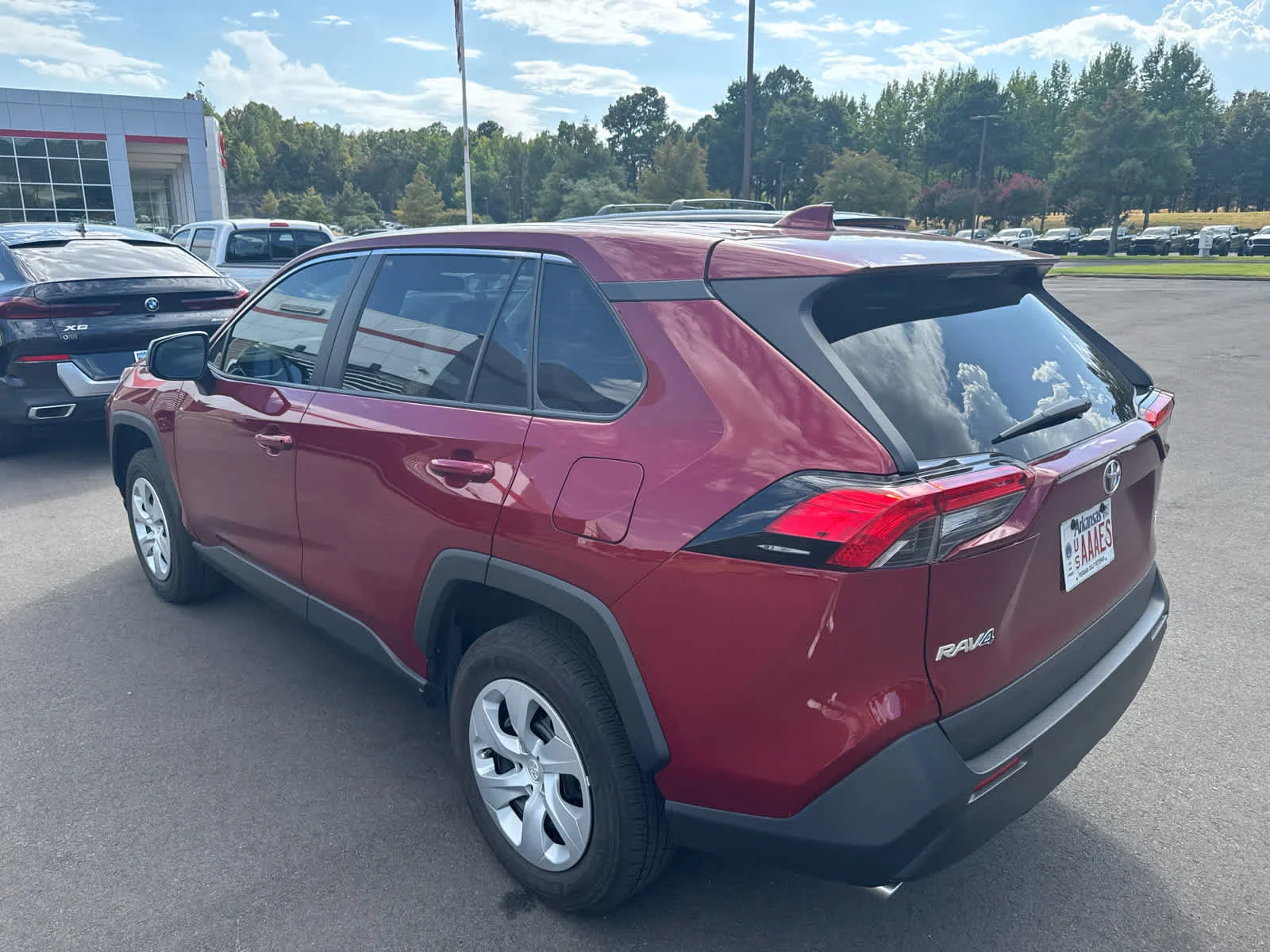 Certified Used 2025 Ruby Flare Pearl Toyota LE image 3