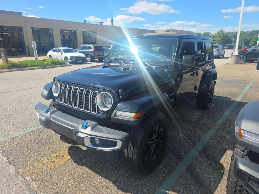Used 2024 Black Jeep Sahara 4xe image 1