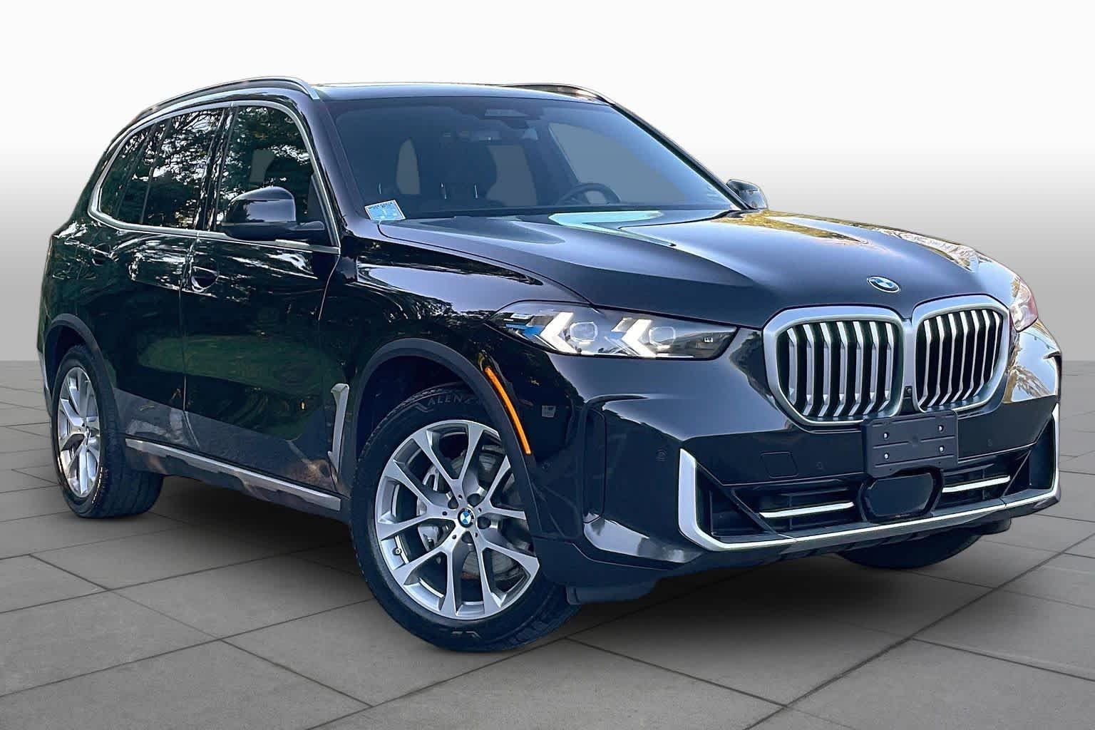 Certified Used 2024 Black Sapphire Metallic BMW xDrive40i image 2
