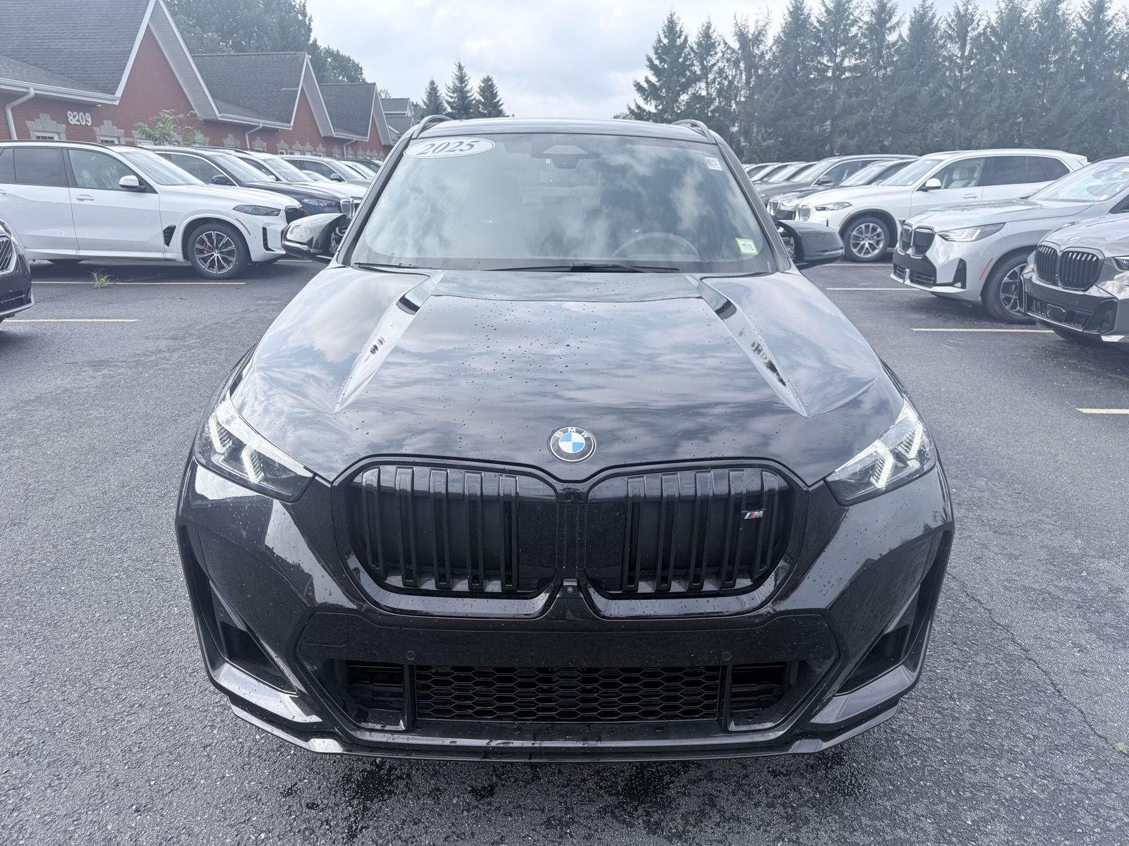 Used 2025 Black Sapphire Metallic BMW M35i image 2