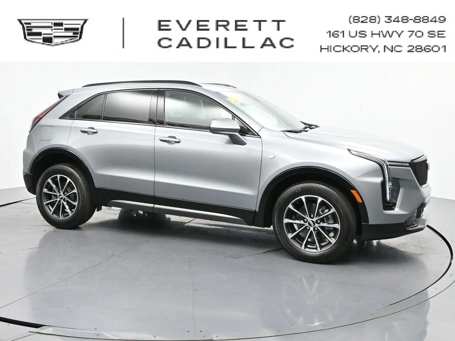Used 2024 Argent Silver Metallic Cadillac Sport image 1