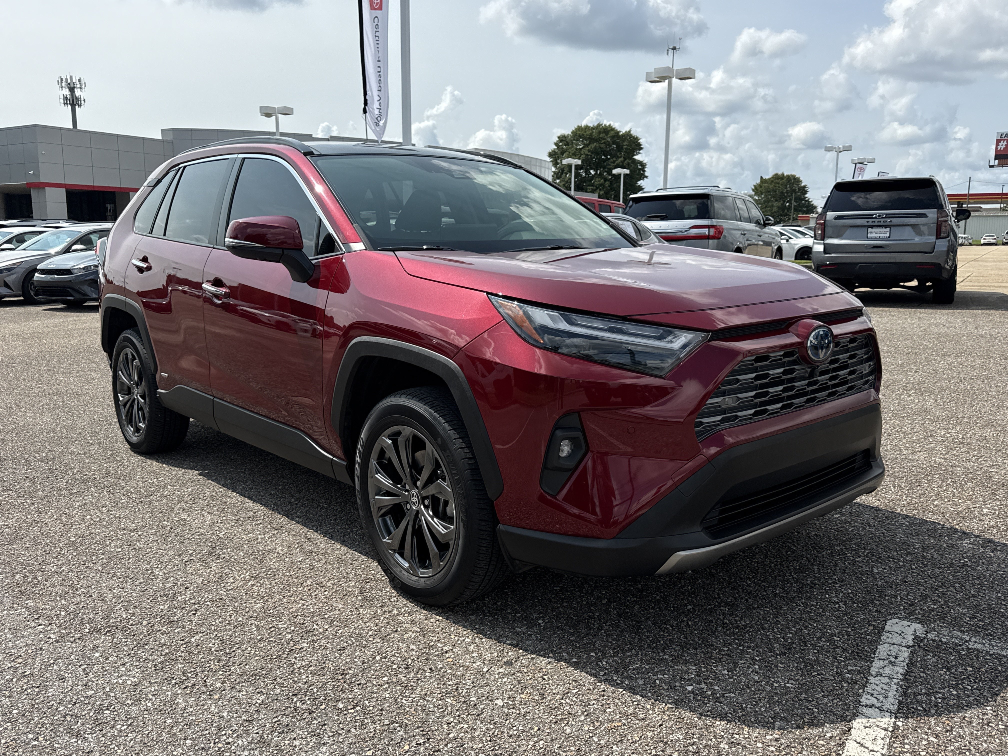 Used 2024 Ruby Flare Pearl Toyota Hybrid Limited image 1
