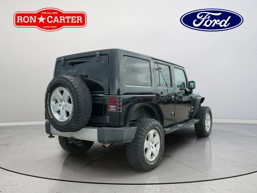 Used 2012 Black Jeep Unlimited Sahara image 6
