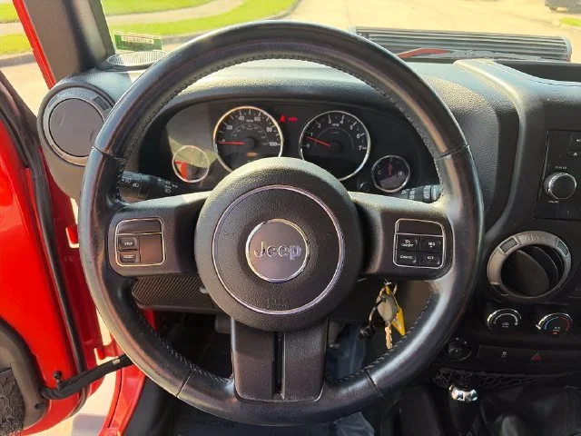 Used 2015 Orange Jeep Unlimited Sport image 16