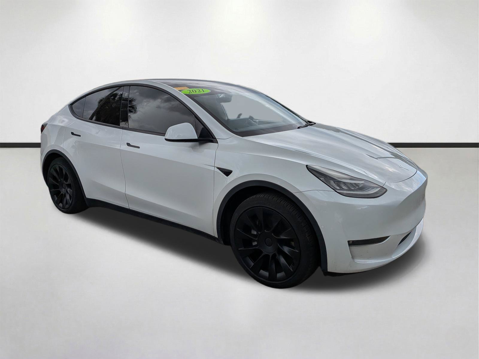 Used 2021 Tesla Model Y Standard Range with VIN 5YJYGDED7MF125893 for sale in Fort Myers, FL