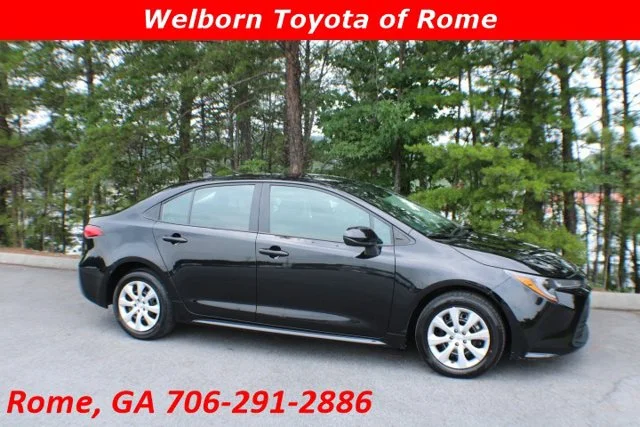 Used 2025 Midnight Black Metallic Toyota LE image 1