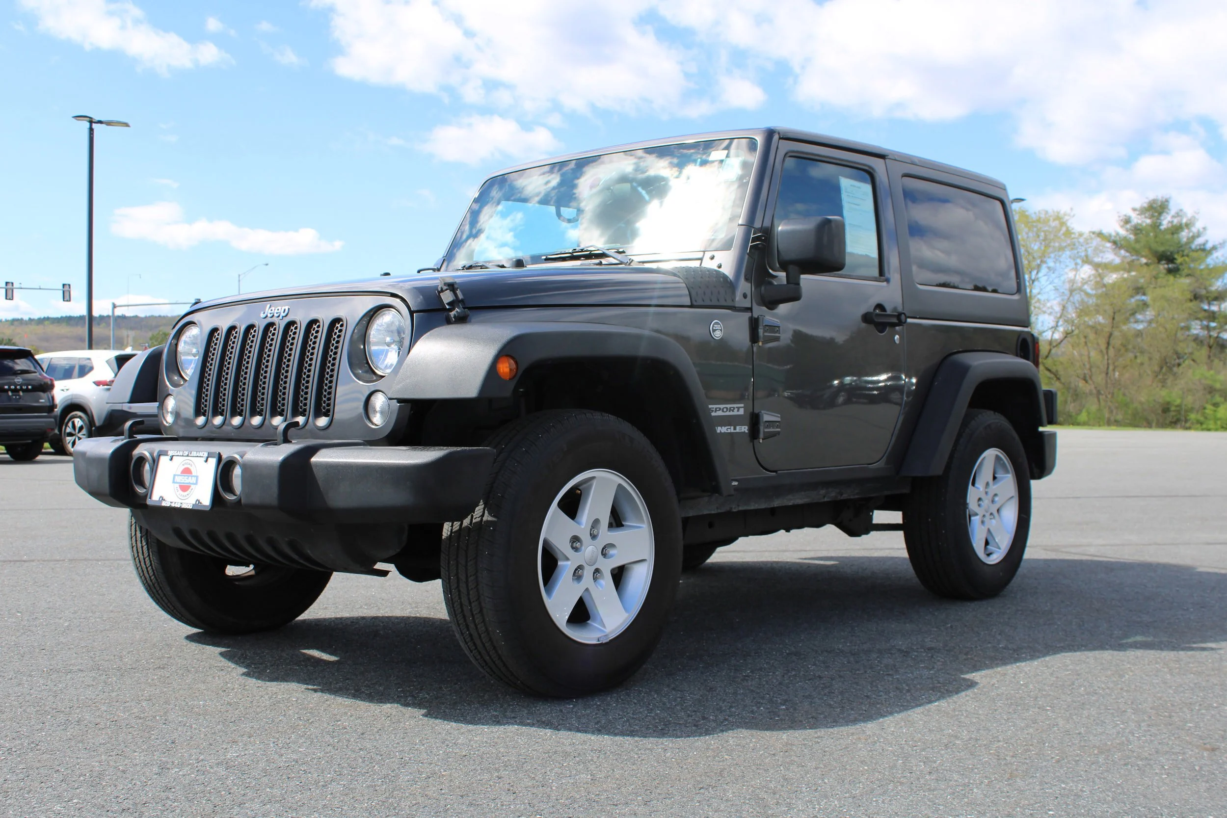 Used 2017 Granite Crystal Metallic Clearcoat Jeep Sport image 1