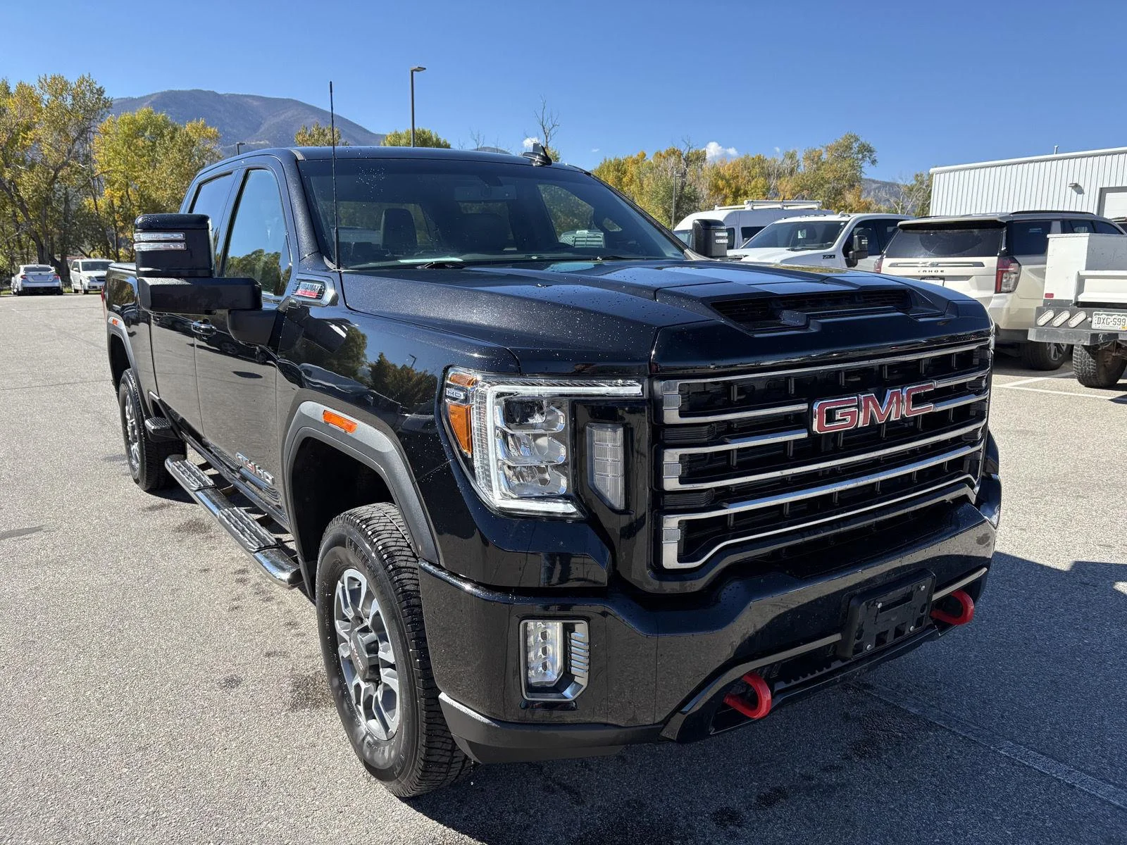 Used 2023 EBONY TWILIGHT METALLIC GMC AT4 image 4