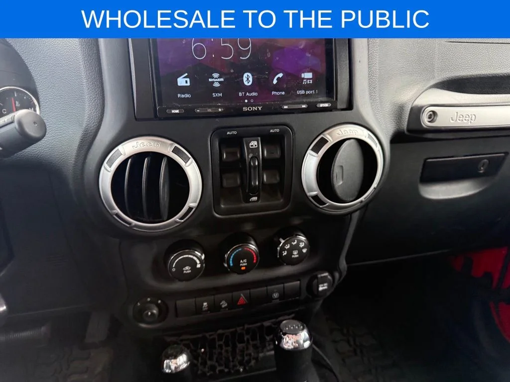 Used 2016 Red Jeep Unlimited Sahara image 13
