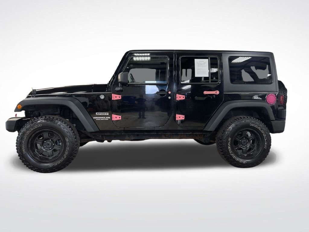 Used 2013 Black Jeep Unlimited Sport image 2