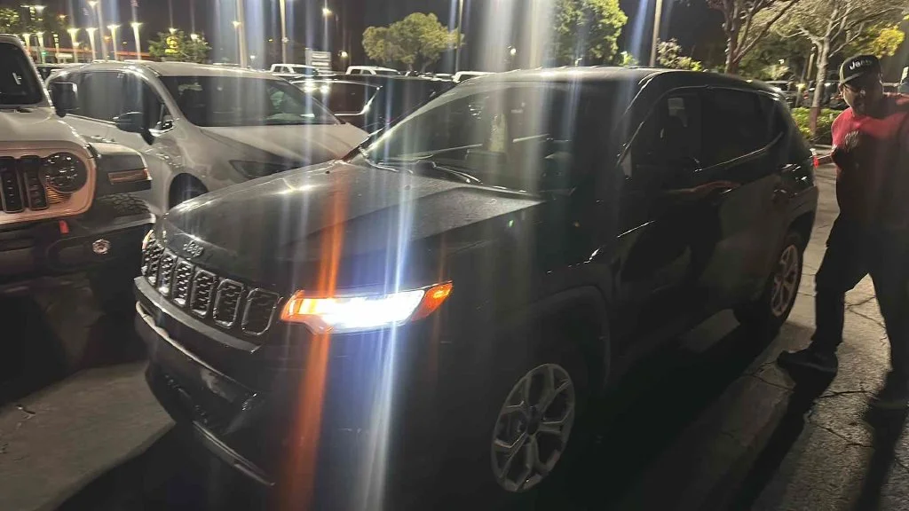 Used 2025 Black Jeep Sport image 1