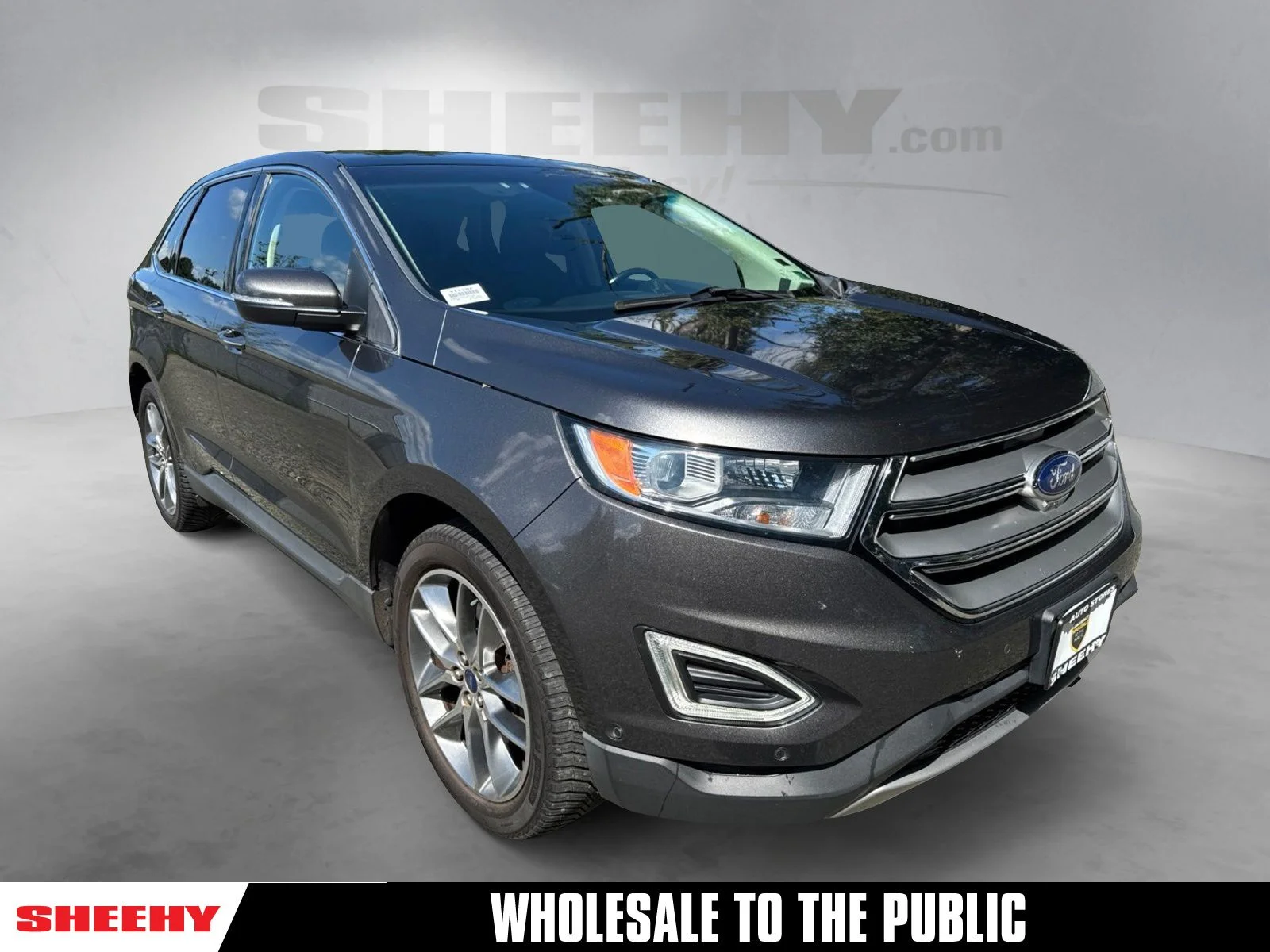 Used 2016 Magnetic Metallic Ford Titanium image 1
