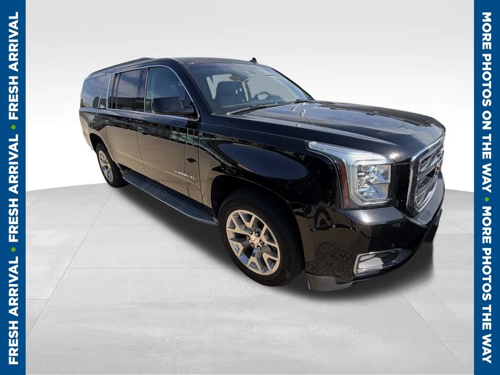 Used 2015 Black GMC SLT 1500 image 1